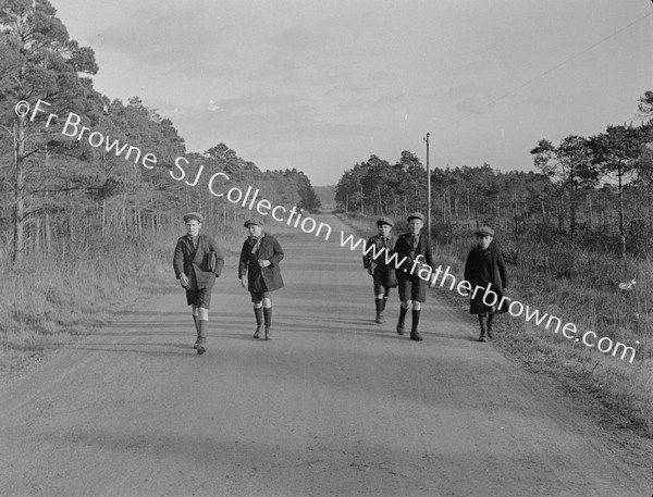 SCHOOL BOYS ON COUNTRY ROAD